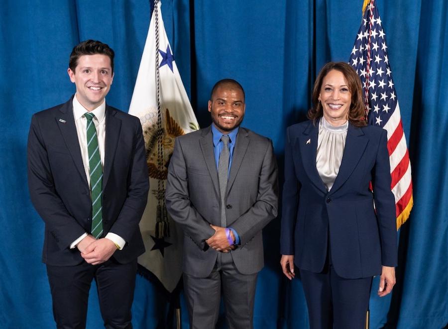 Kamala Harris, Isaiah 博尔登, Ike Irby in front of flags