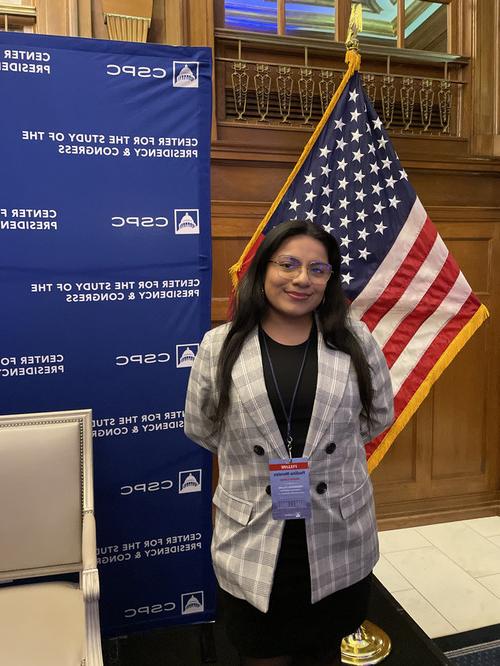 paulina morales in front of flag